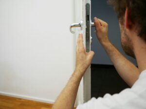a man holding a door handle