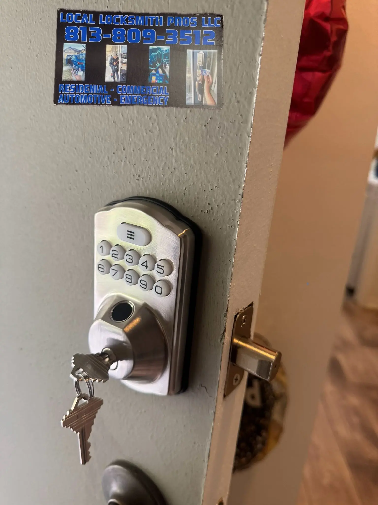 A silver electronic keypad lock installed on an office door, showcasing the expert Commercial Locksmith Services offered by Local Locksmith Pros LLC.