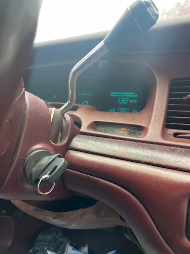The ignition of an older model car with a broken key stuck inside, indicating a need for Ignition Repair Services from Local Locksmith Pros LLC.